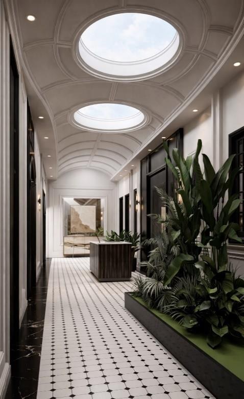 A skylit gallery brings daylight and planting deep into the plan.